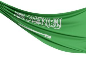The flag of the Kingdom of Saudi Arabia flies in the Kingdom's sky.
